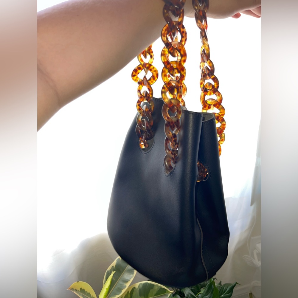 Faux Leather Bucket Bag with Tortoiseshell Chain